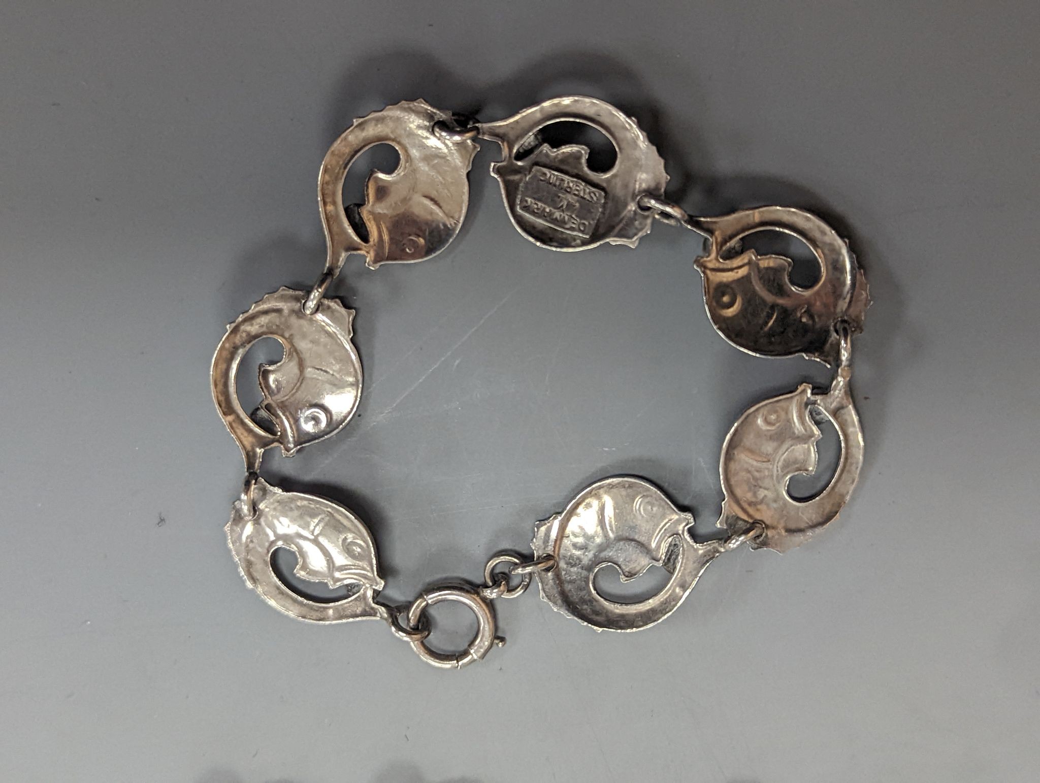 A Danecraft sterling flower head link necklace, 42cm and a Danish sterling fish link bracelet.